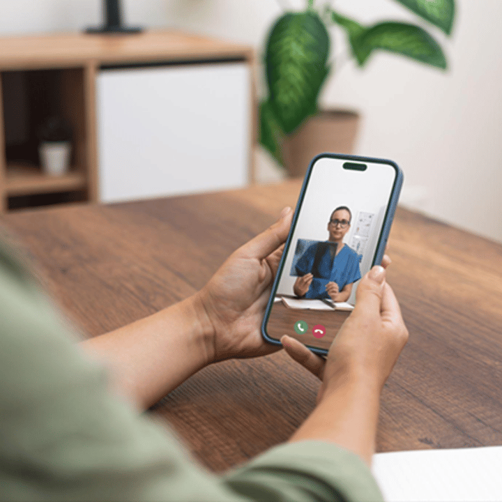 A doctor discussing a treatment plan with a patient via a digital appointment