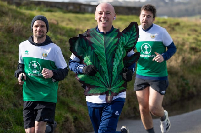 Runners with a participant in a leaf costume.