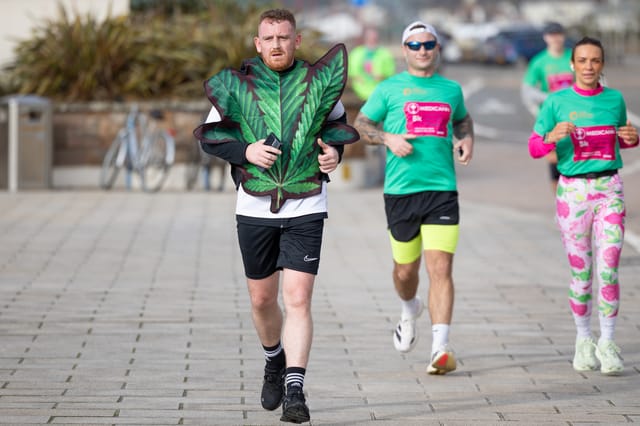 Three participants running together.